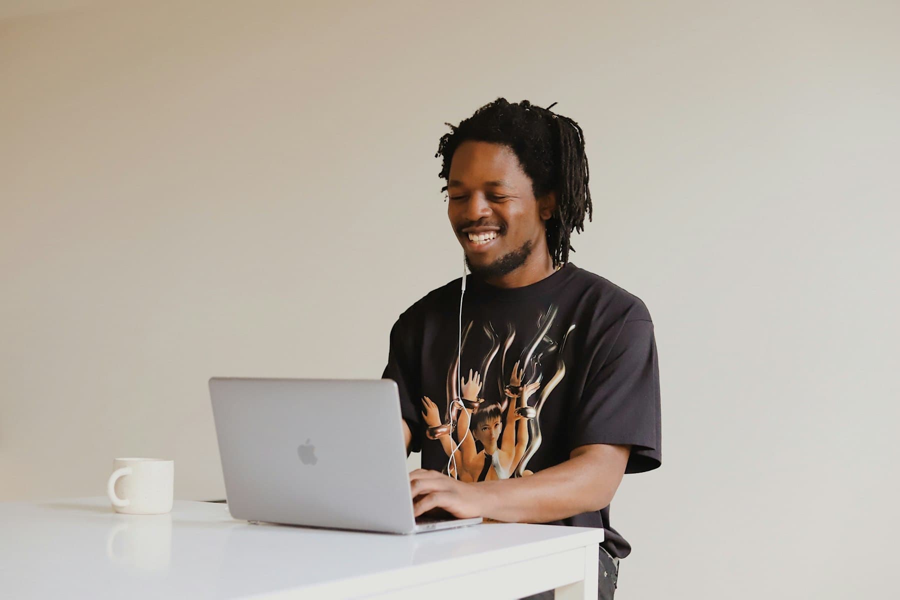 Smiling developer working at a laptop