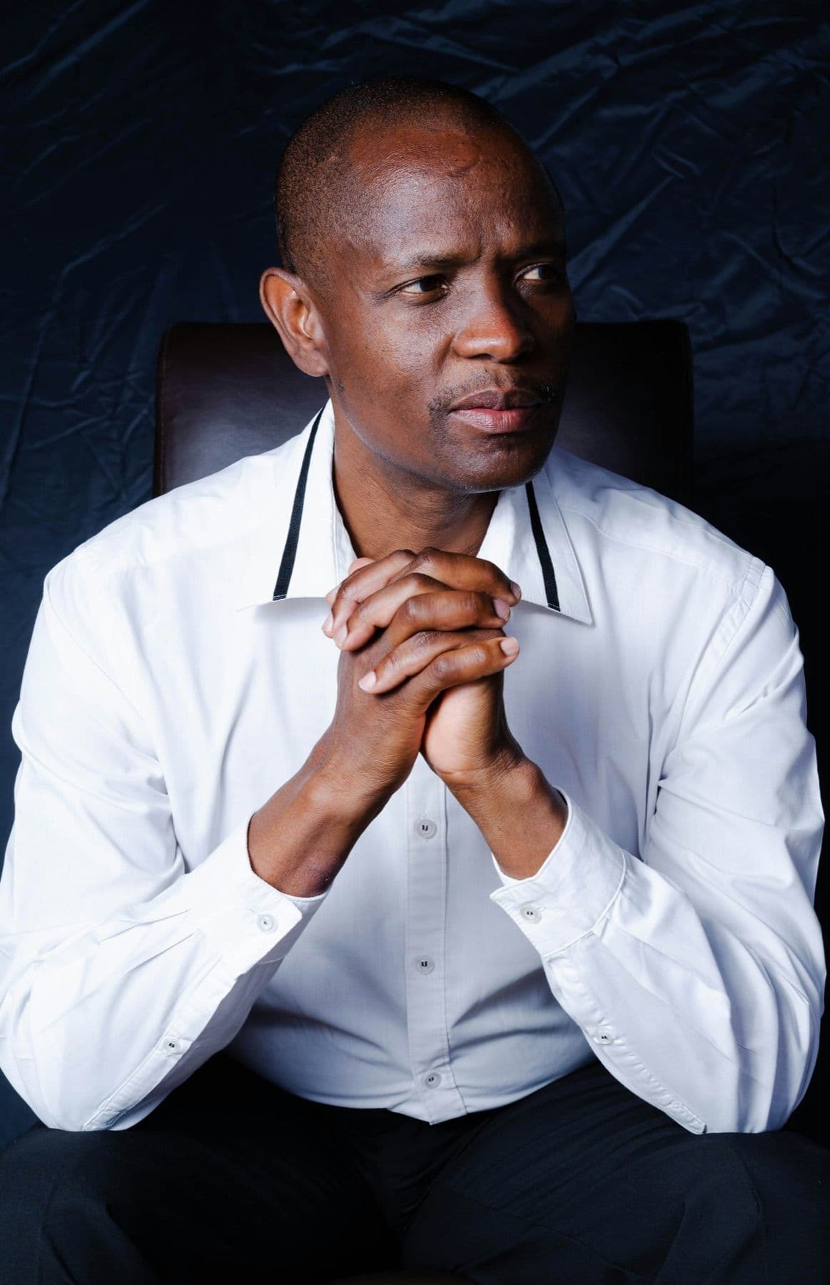 Executive seated in a thoughtful pose